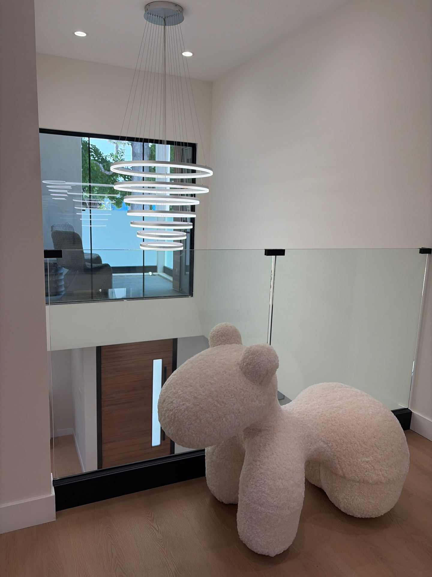 Two-story foyer with sculptural chandelier